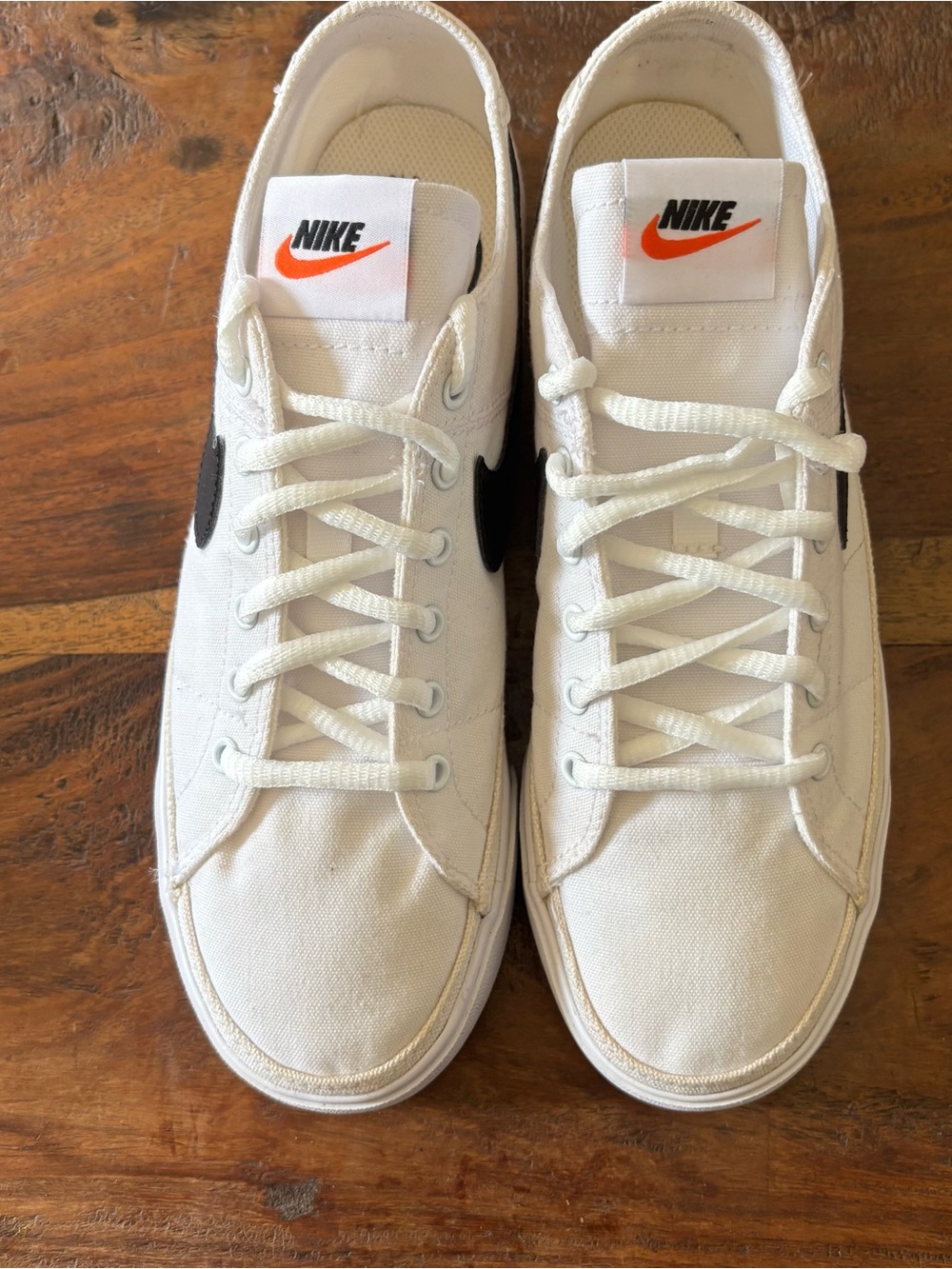 NWOT. Nike Men’s White Canvas Low-Top Sneakers with Black Swoosh